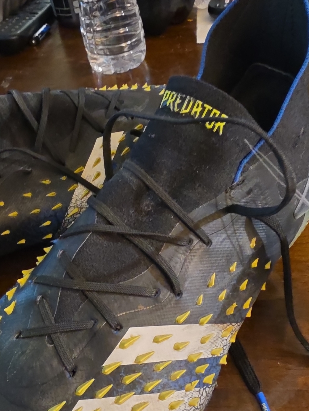 adidas Black Soccer Cleats with Yellow Stud Accents